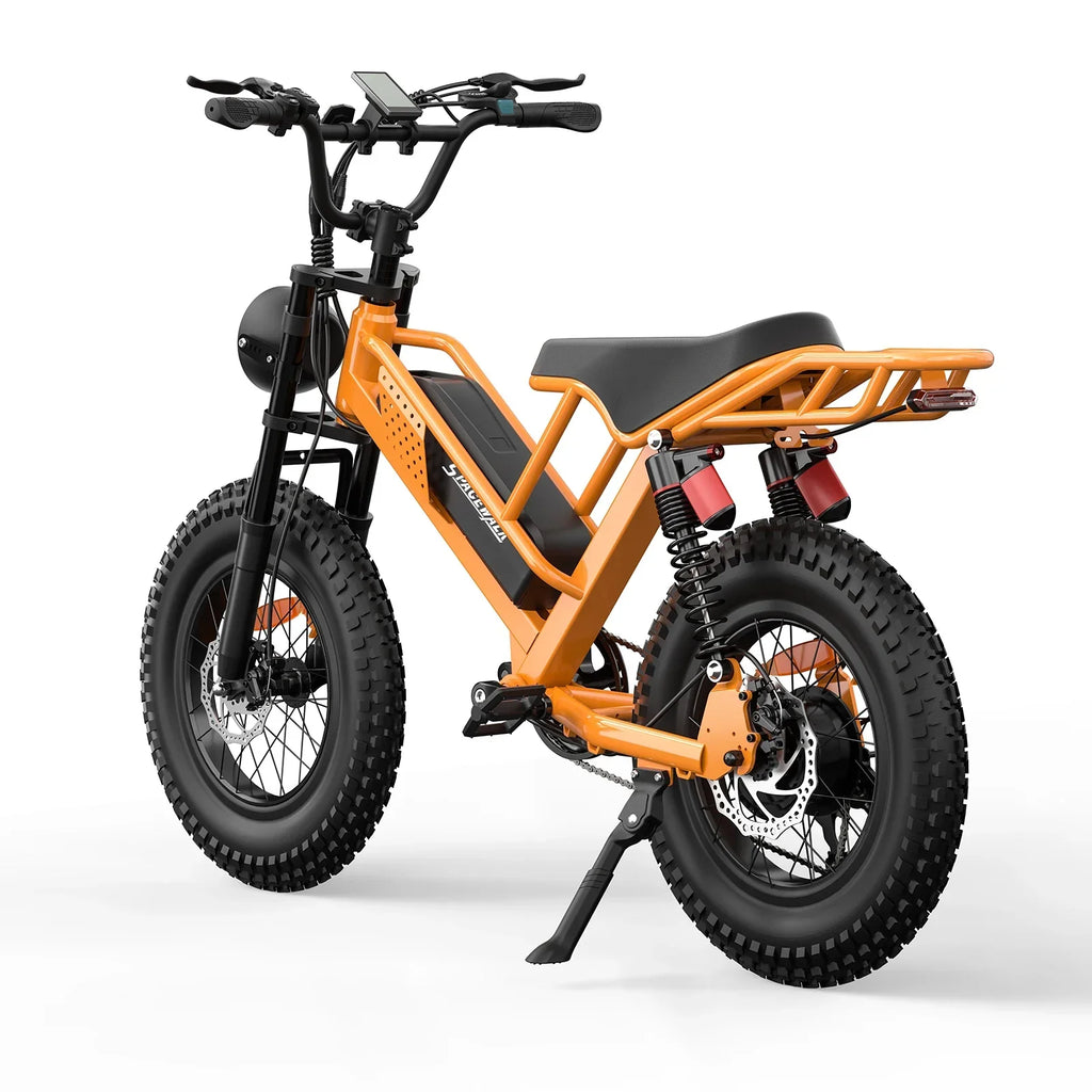 Orange electric bike with fat tires and rear cargo rack on white background