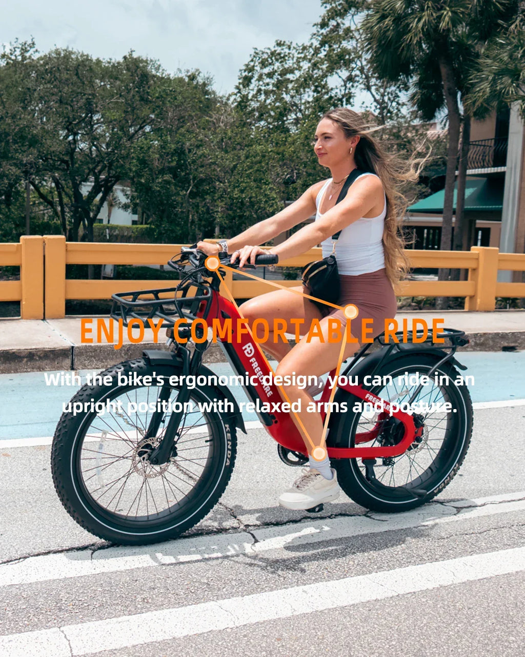 Woman riding a red electric bike on a city street, showing ergonomic comfort and upright posture.