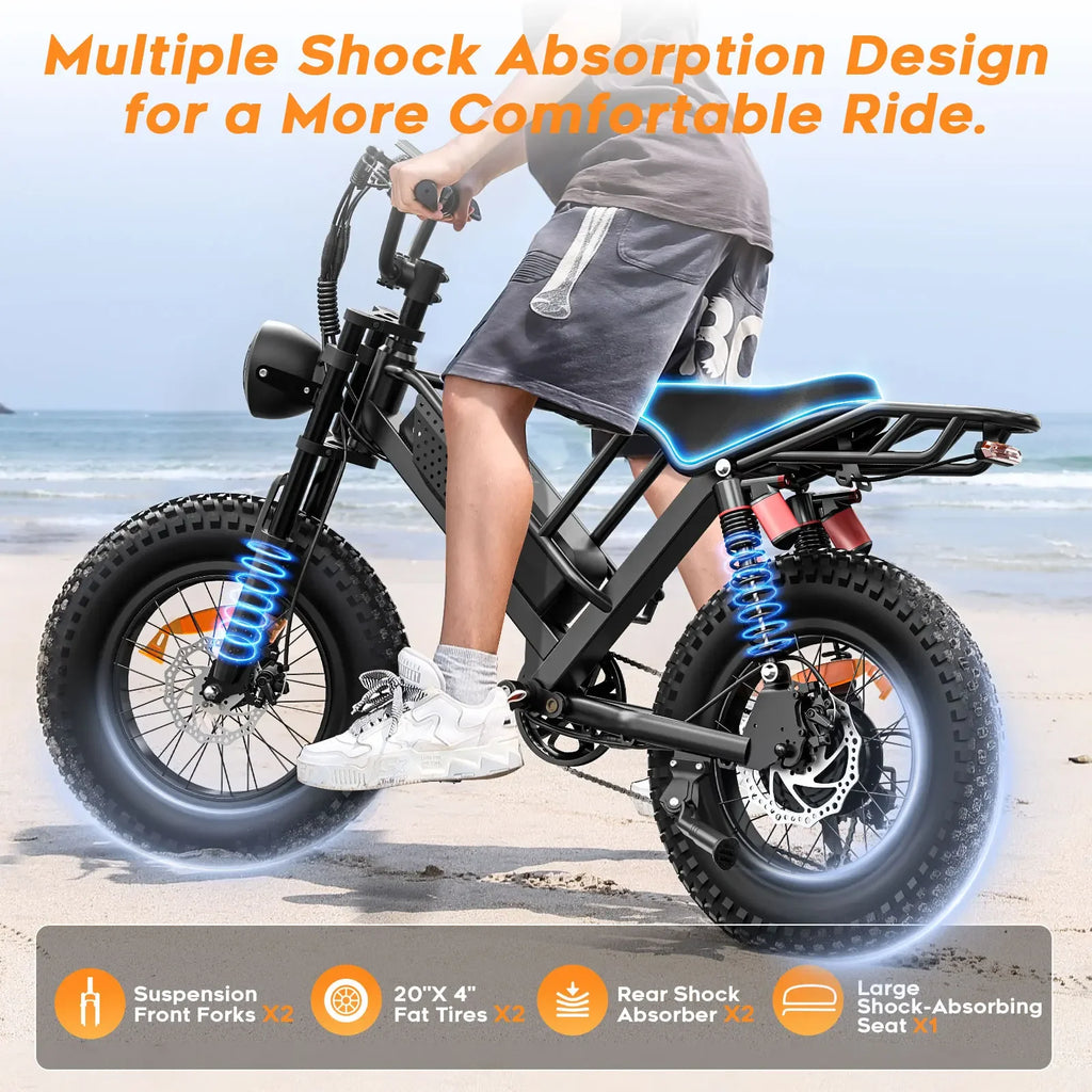 Fat tire electric bike with advanced shock absorption, ridden on a sandy beach setting.