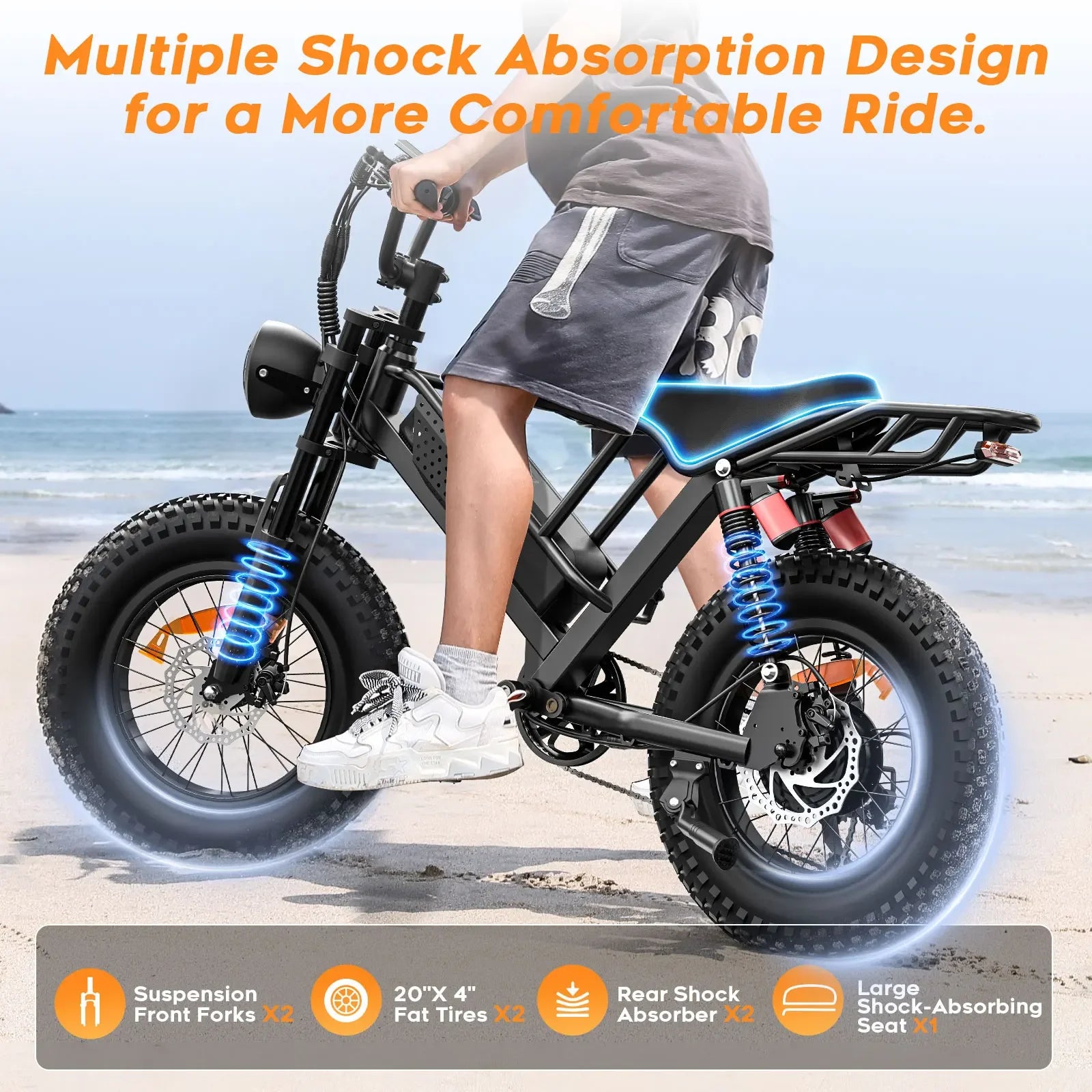 Fat tire electric bike with advanced shock absorption, ridden on a sandy beach setting.