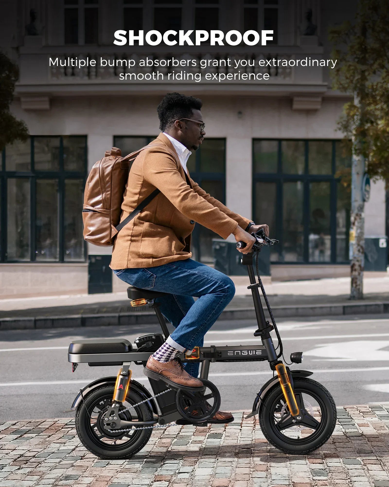 Man riding a shockproof electric bike with bump absorbers on city street