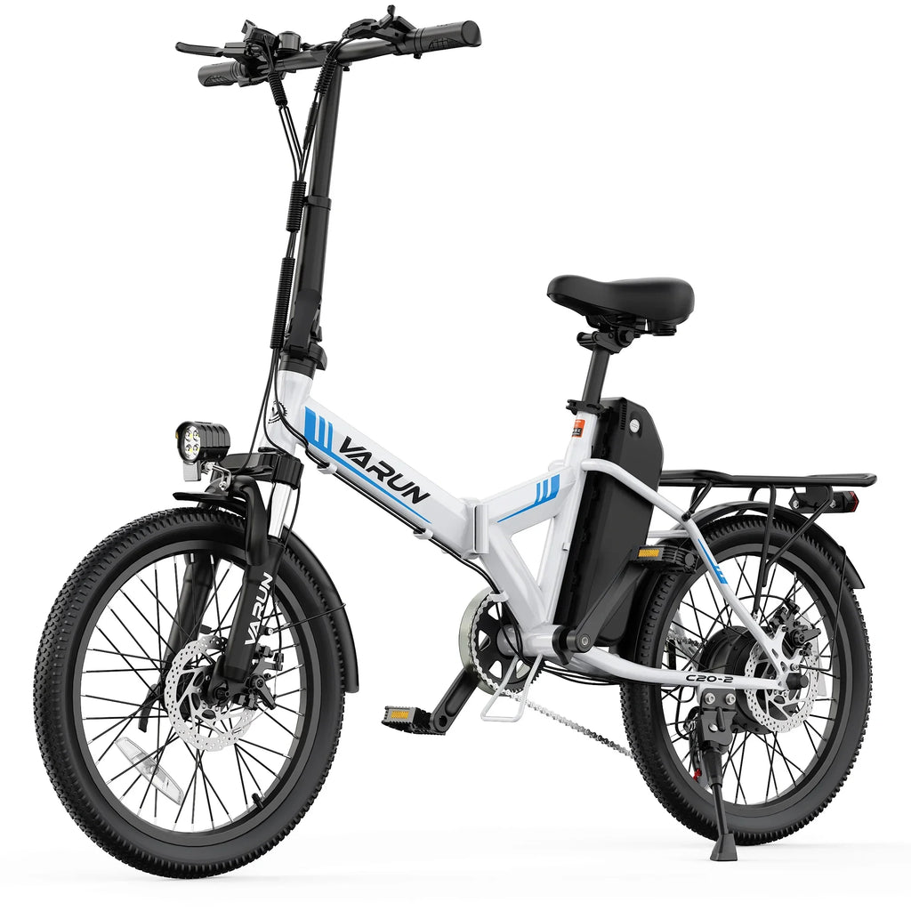 White folding electric bike with thick tires, rear rack, and front headlight on white background